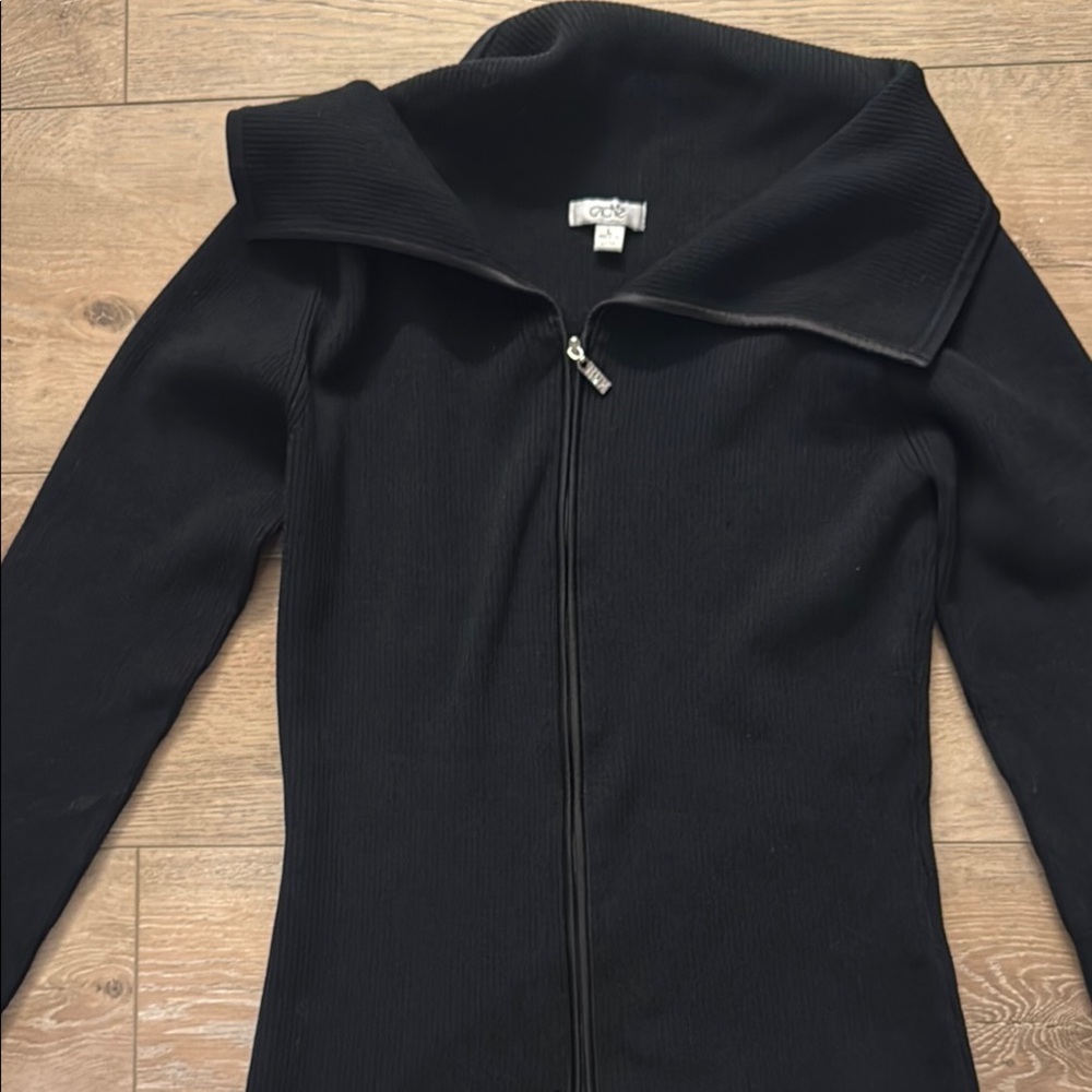 Zip front sweater.  Perfect condition.  Rhinestone zip adds character